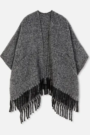 Primark Geborstelde cape met kwastjes