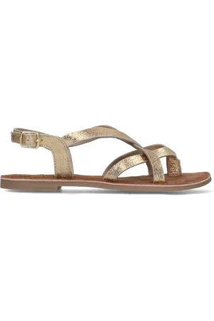 Sacha Gouden leren sandalen met gekruiste bandjes