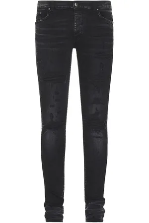 AMIRI Slim fit thrasher plus verouderde zwarte denimjeans