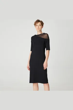 S.J. Minimalistische jerseyjurk met asymmetrisch snijden