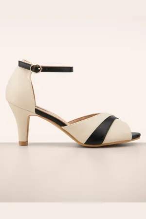 Banned Retro April Dazzle peeptoe pumps in zwart en crème