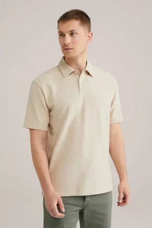 WE Fashion Relaxed polo met ingebreid patroon beige