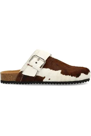 Manfield Leren clogs met ponyhair en koeienprint
